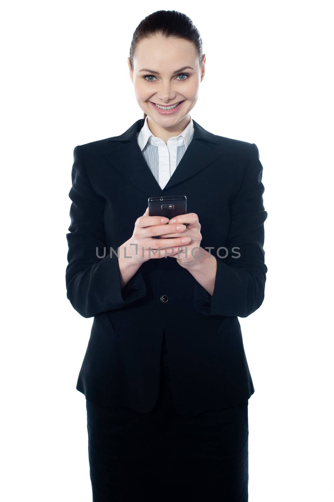 Amarican female assistant texting, smiling at camera