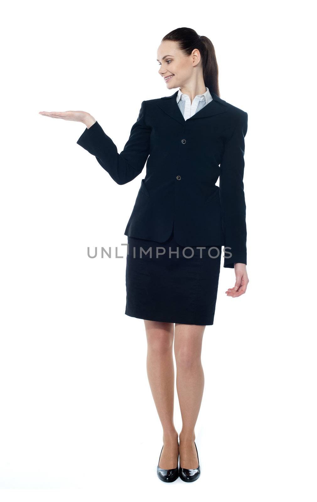 Lady presenting copyspace in business by stockyimages