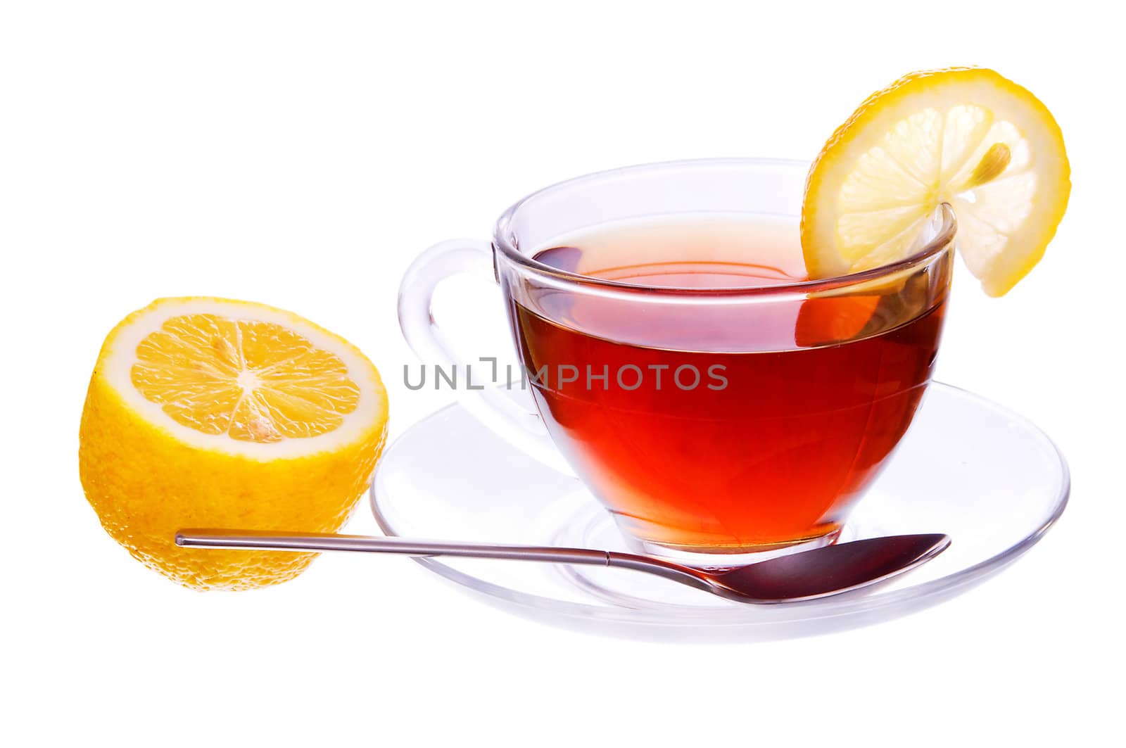 Transparent cup with black tea with a lemon and spoon isolated on white background