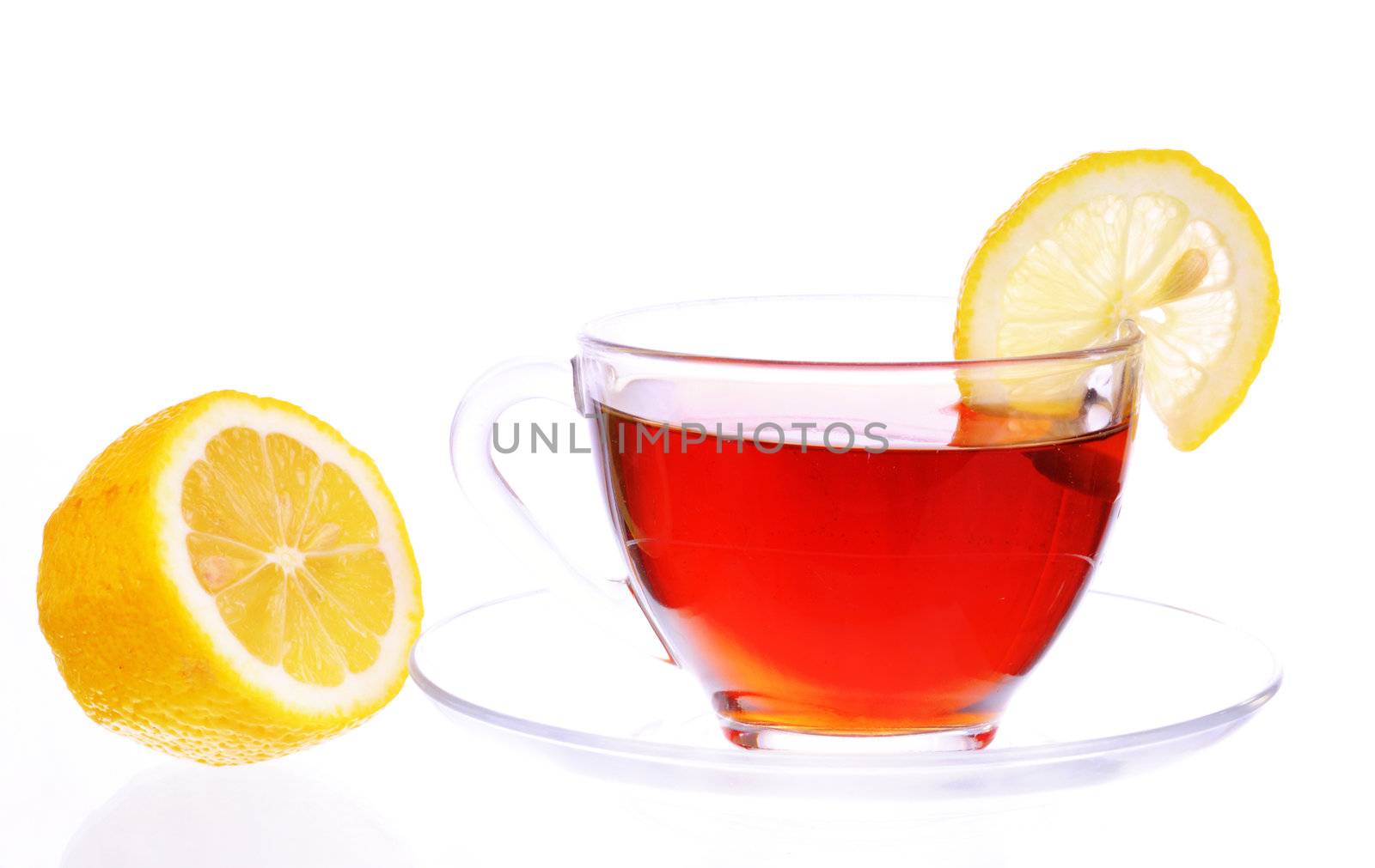 Transparent cup with black tea with a lemon