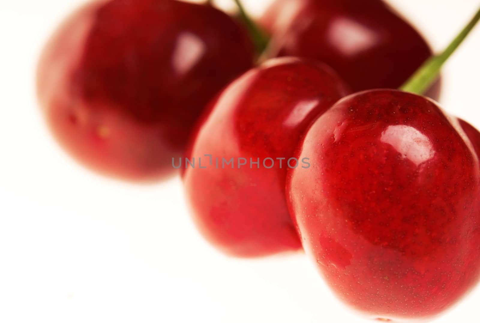 Four ripe fresh cherry close-up