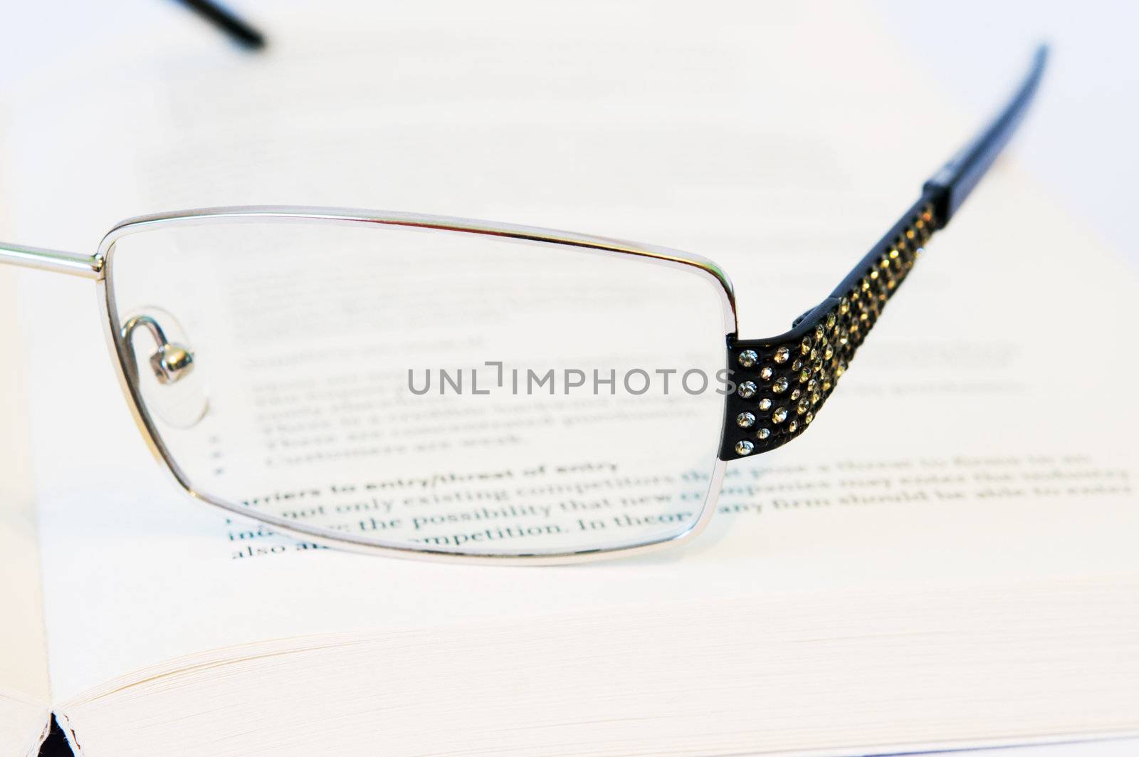 Glasses with on a book close-up
