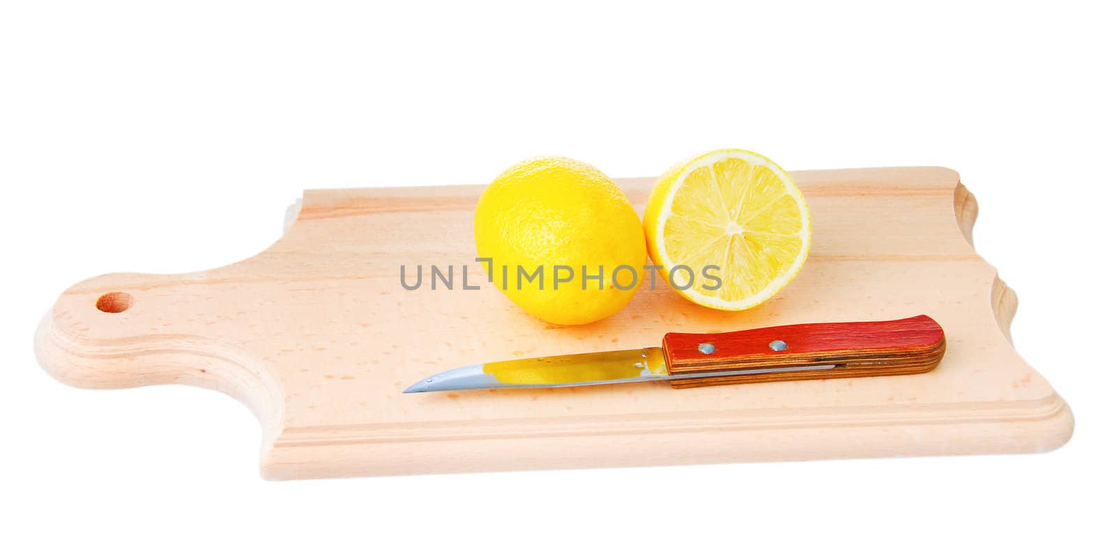 One whole lemon and one cutted lemon with knife on wooden plank. Isolated on white background.