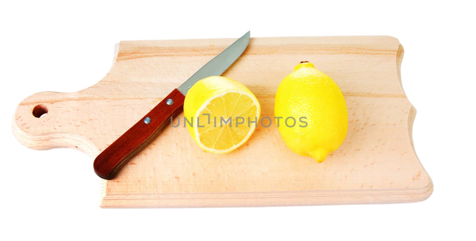 One whole lemon and one cutted lemon with knife on wooden plank. Isolated on white background.