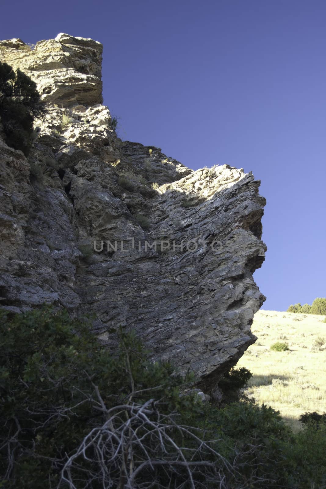 large rock cliffs in American Fork Canyon, Utah viewed from below