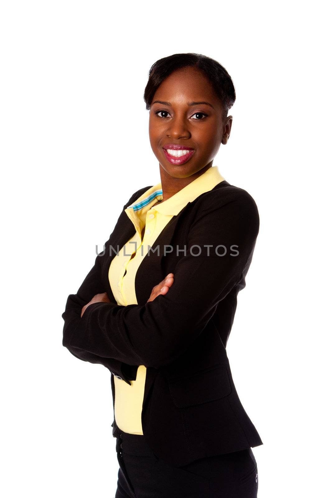 Beautiful happy smiling African business woman in suit and arms crossed, isolated.