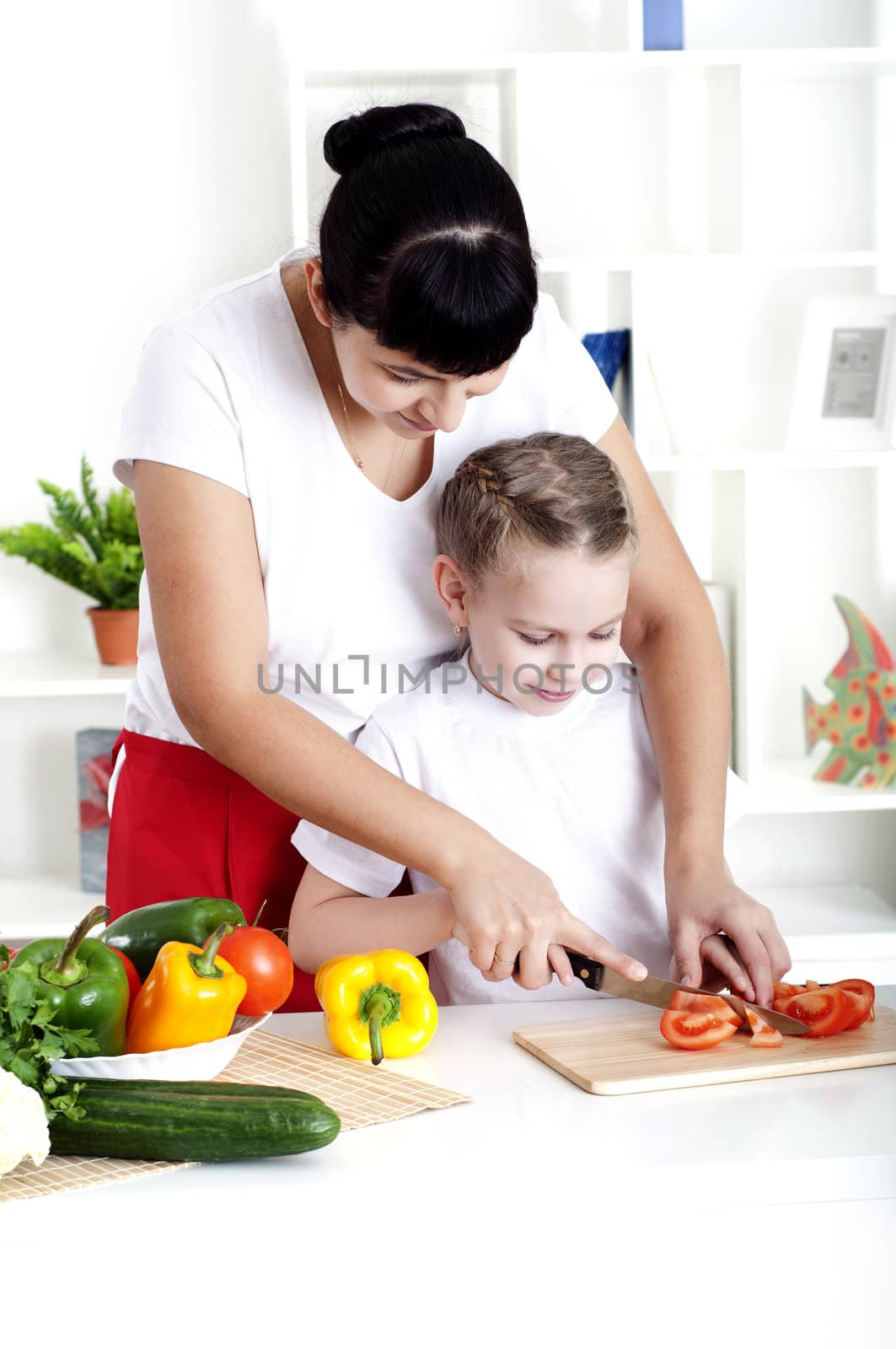 mom and daughter cooking together by adam121