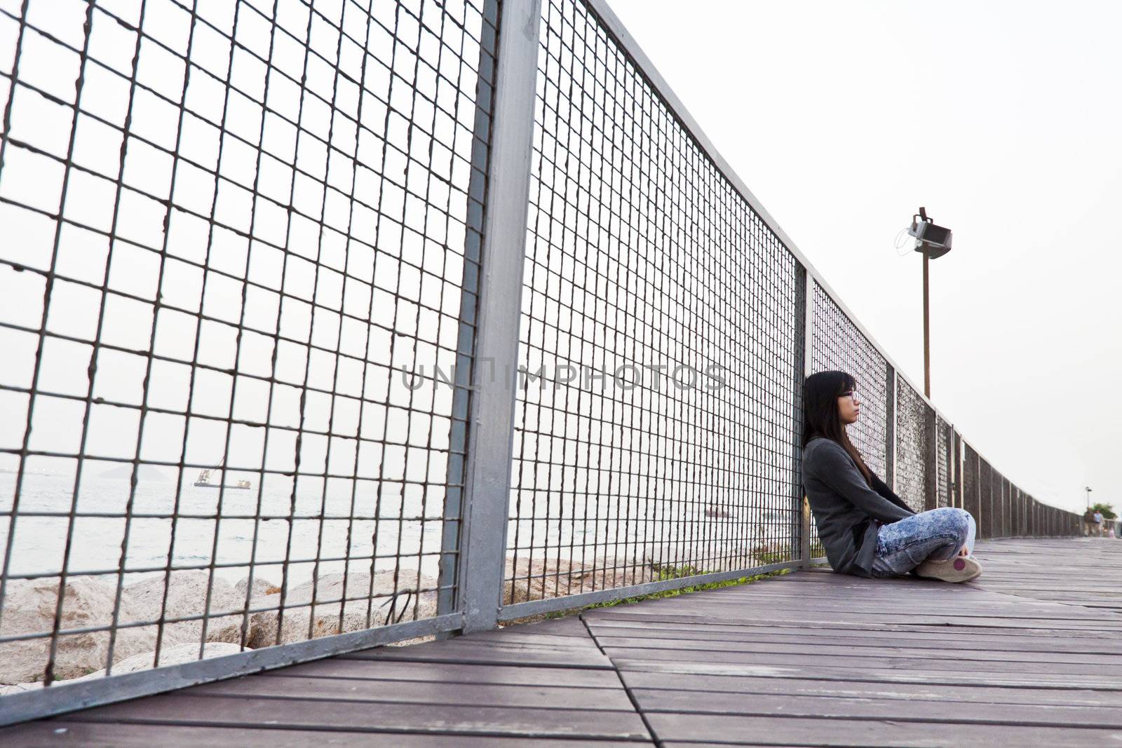 Asian sad woman on floor