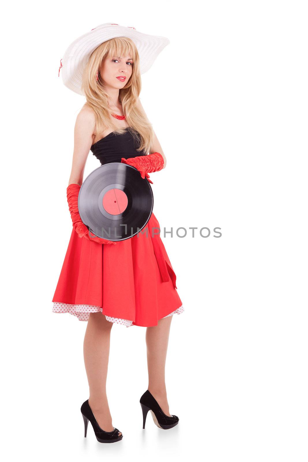 Retro stylish young woman in hat with gramophone record on white background