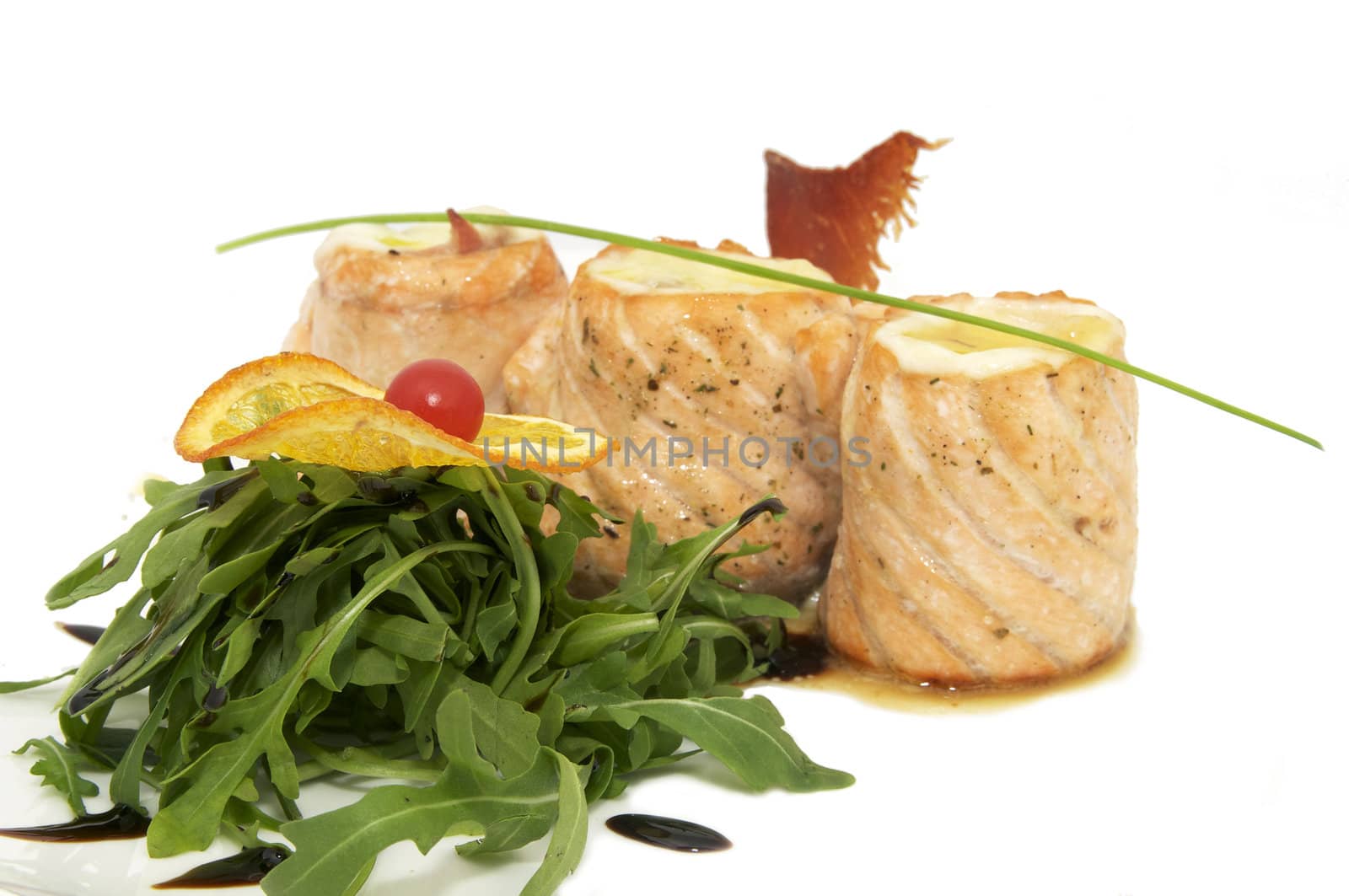 grilled fish with vegetables on a white plate
