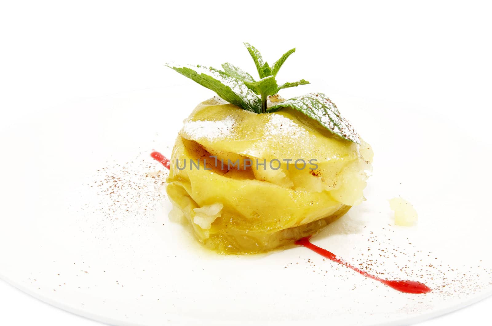 Baked apple with cinnamon sauce on a white background