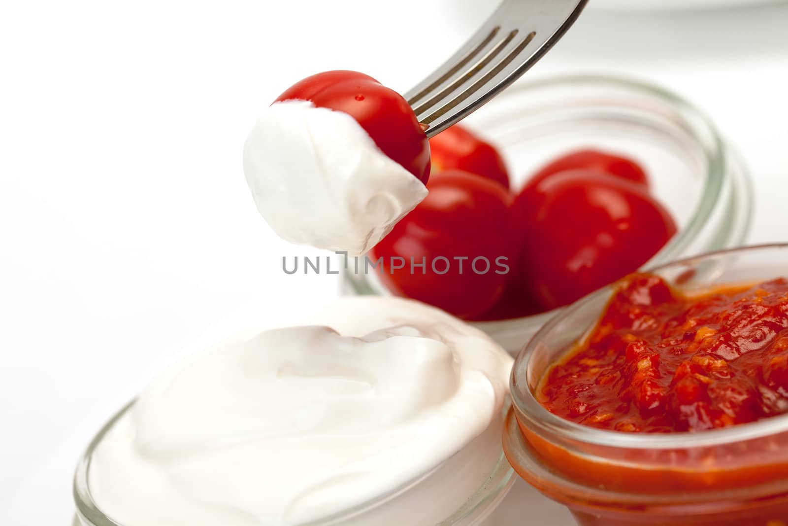 Sour Cream, Catchup and tomato on white background