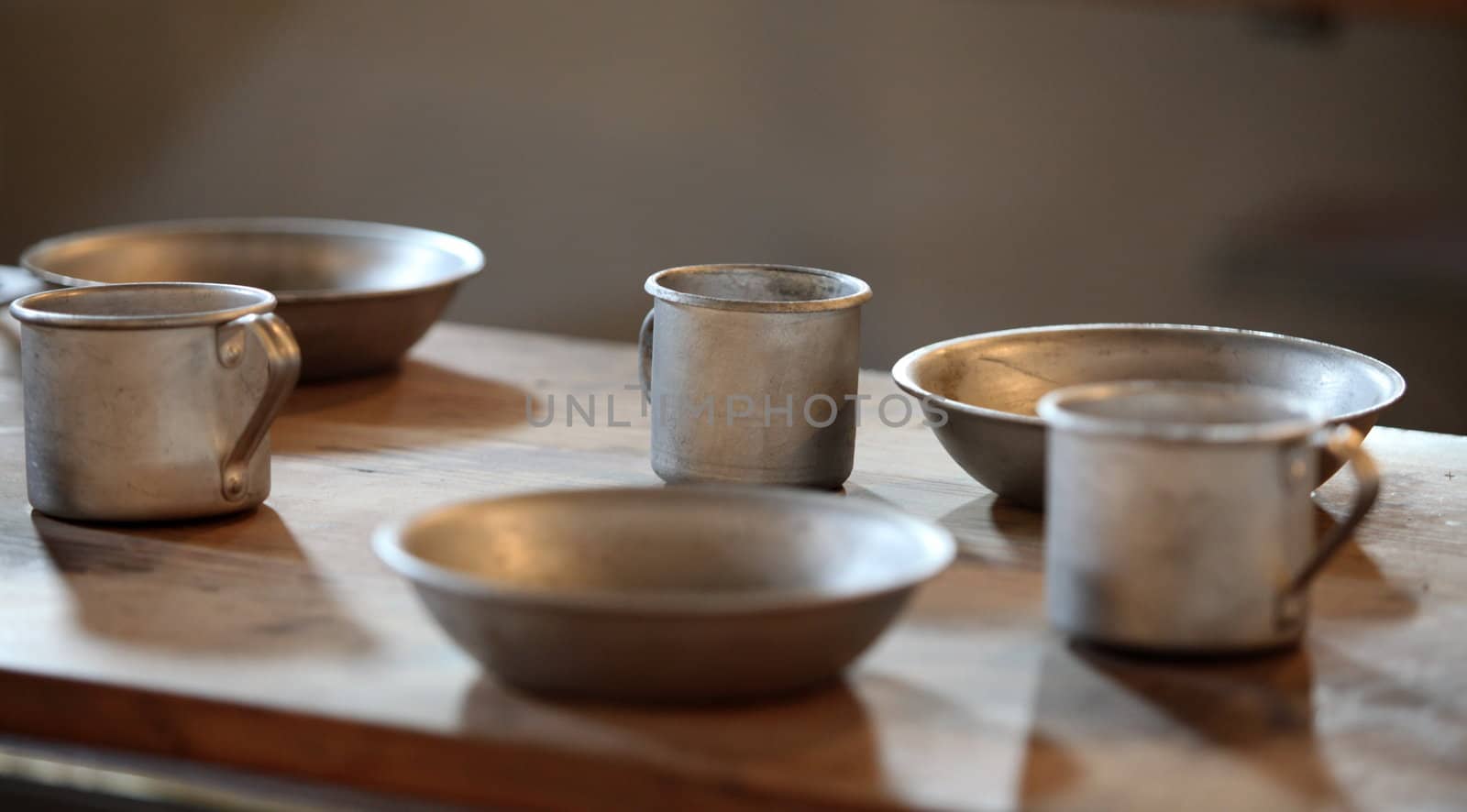 The old aluminum utensils on the table in the chamber