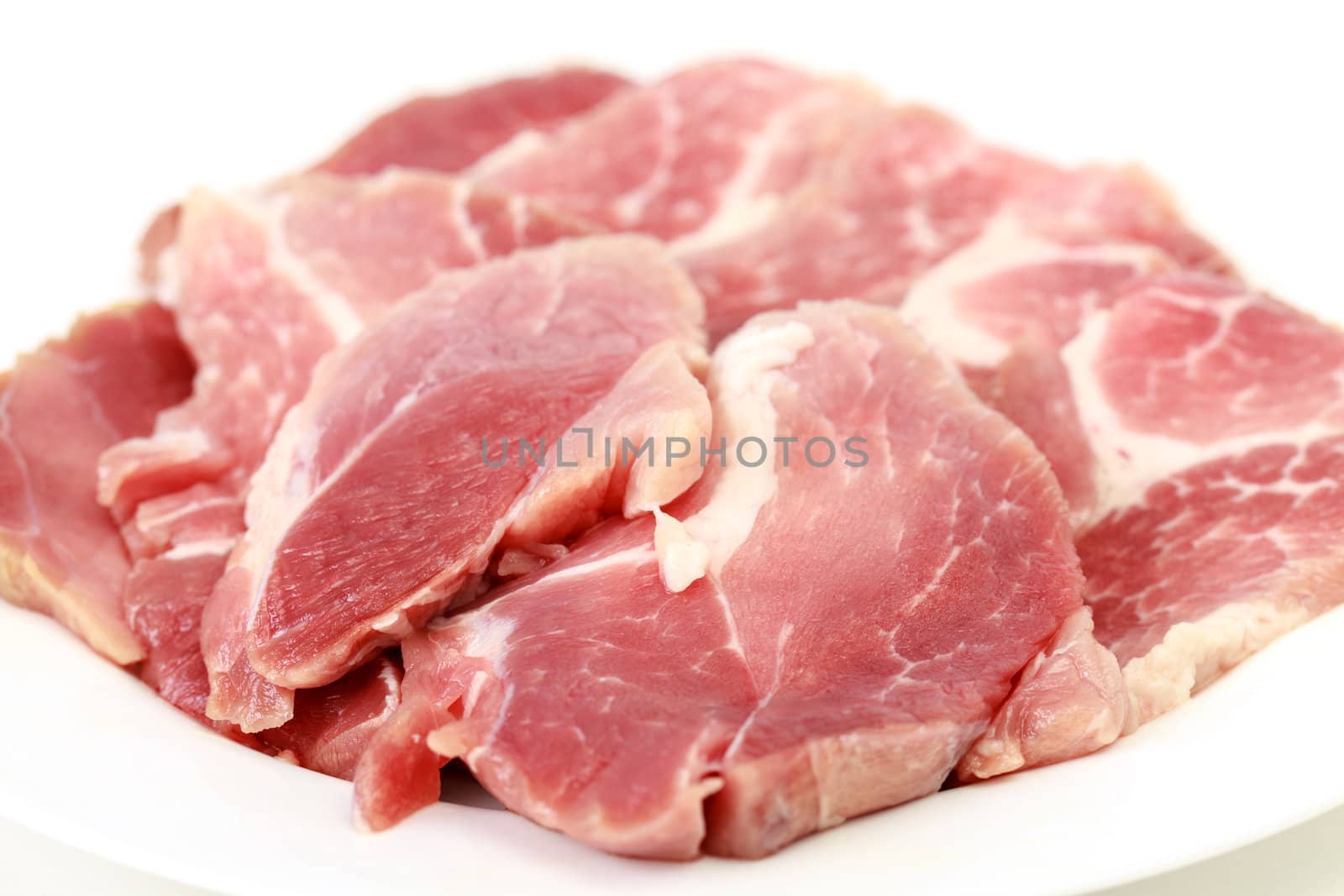 Crude meat on a white backgrounds