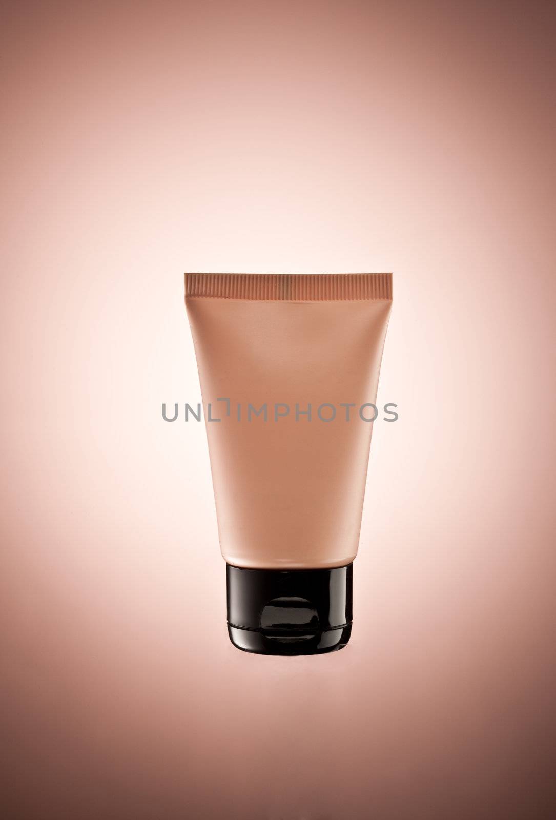 body lotion tube over color gradiented background