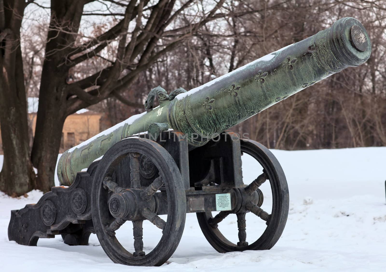 The old medieval bronze cannon on the gun carriage