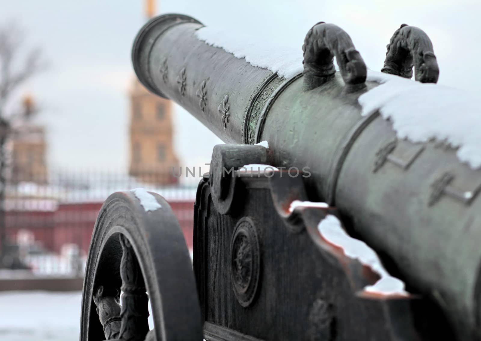 The old medieval bronze cannon on the gun carriage