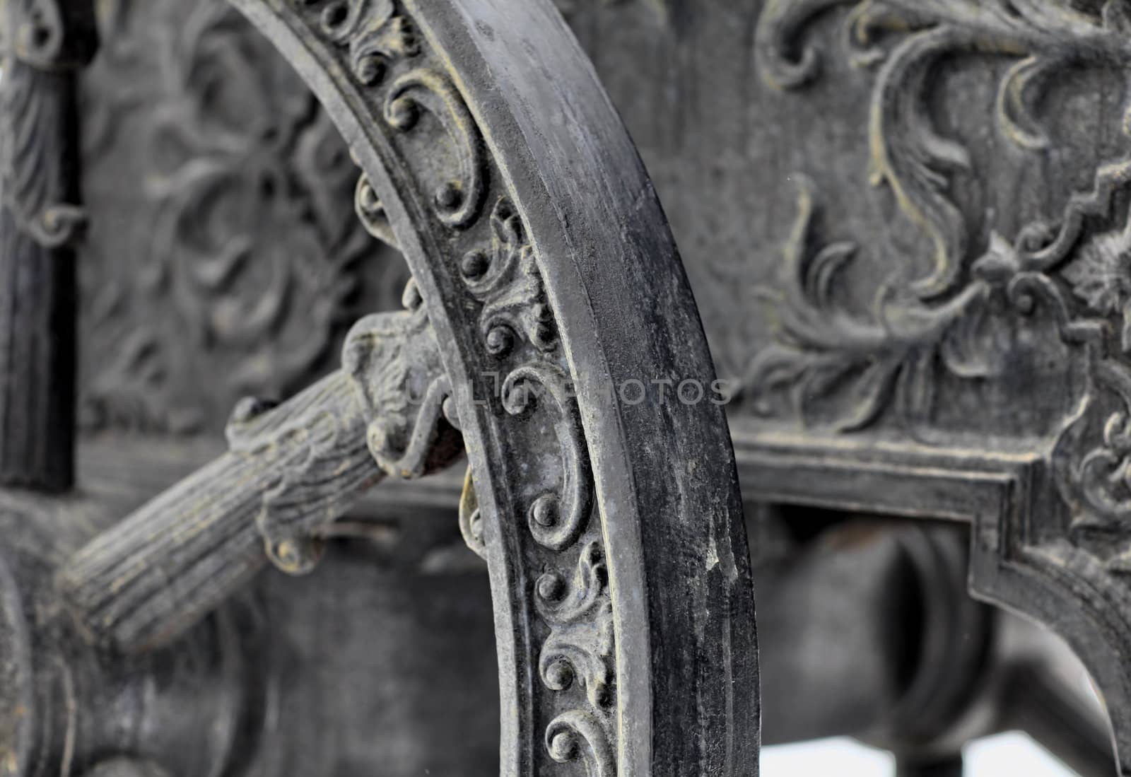 The old medieval bronze cannon on the gun carriage