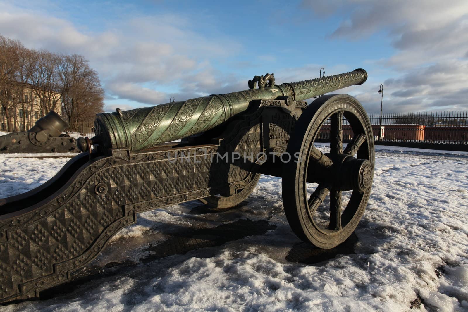 The old medieval bronze cannon on the gun carriage