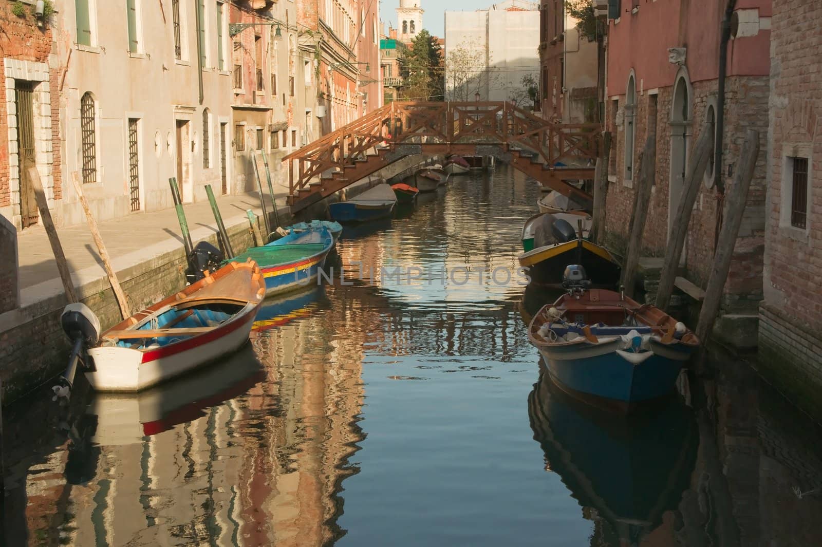 Venetian canal at sunset in the evening light