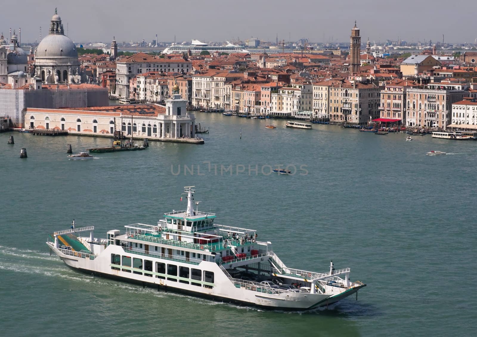 View of Venice with the ferry boat and the Cathedral of Santa Maria della Salute