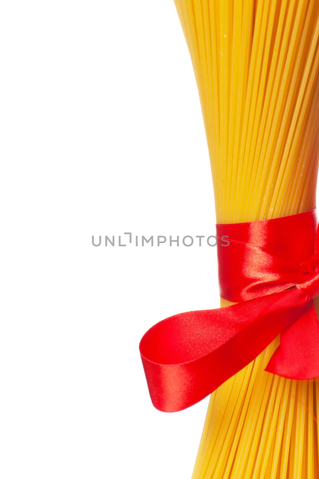 Closeup view of dried macaroni tighten with red ribbon