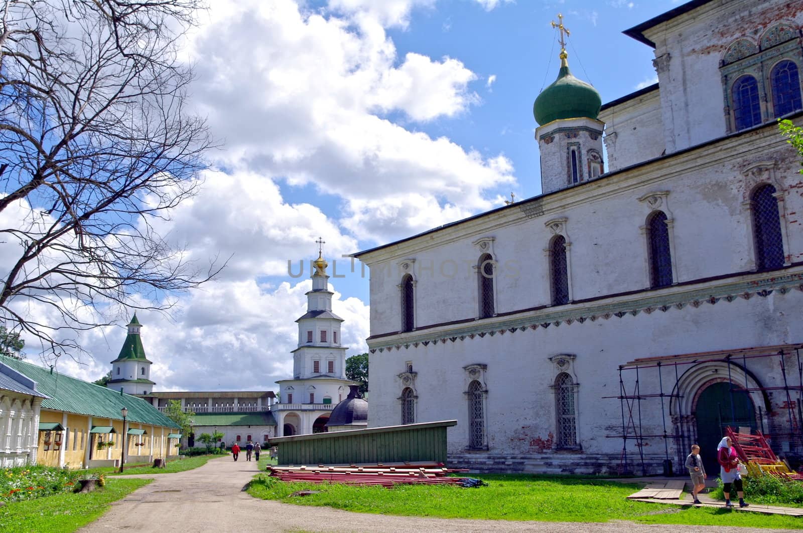 Istra, Russia - June 05, 2010: Summer day. People  walks near the Voskesensky church in New Jerusalem monastery on June 05, 2010 in Istra, Moscow area, Russia