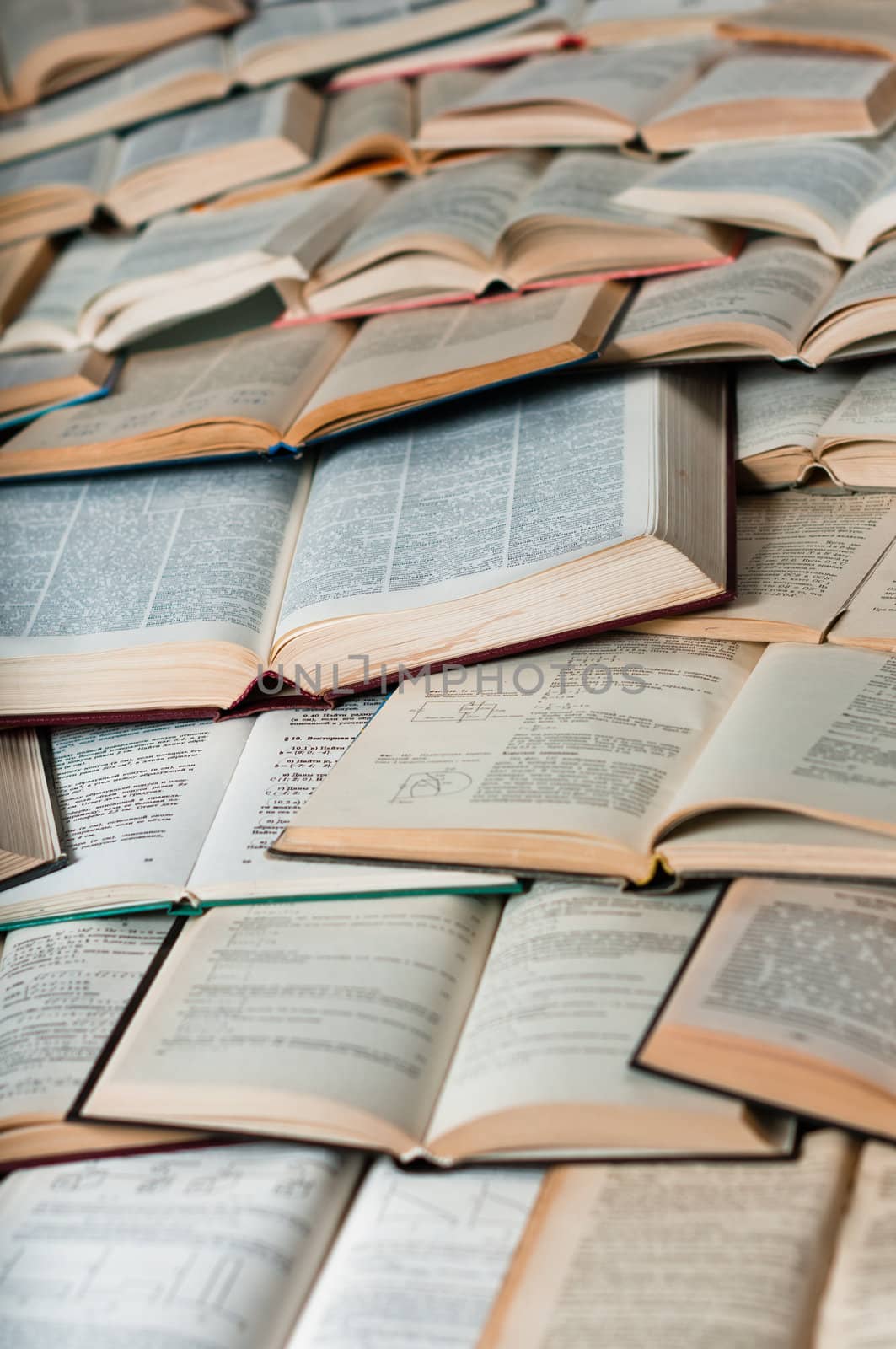 Books making pattern with shadows by dmitryelagin