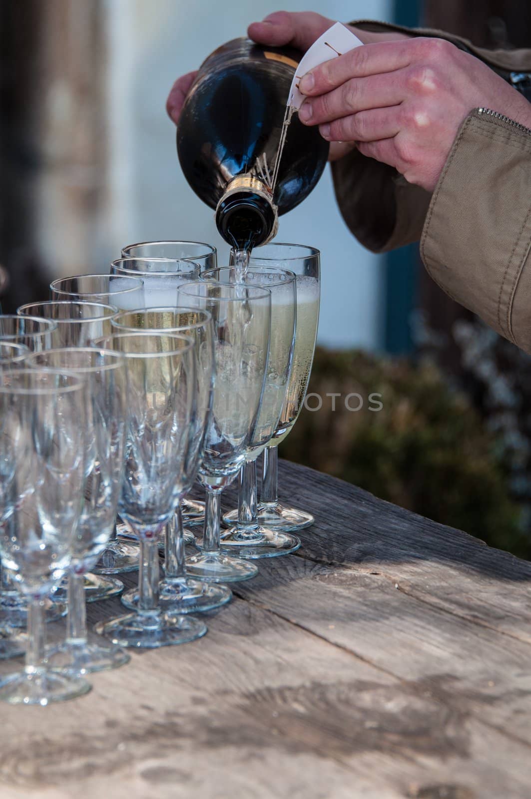 pouring champagne for a toast at a family reception