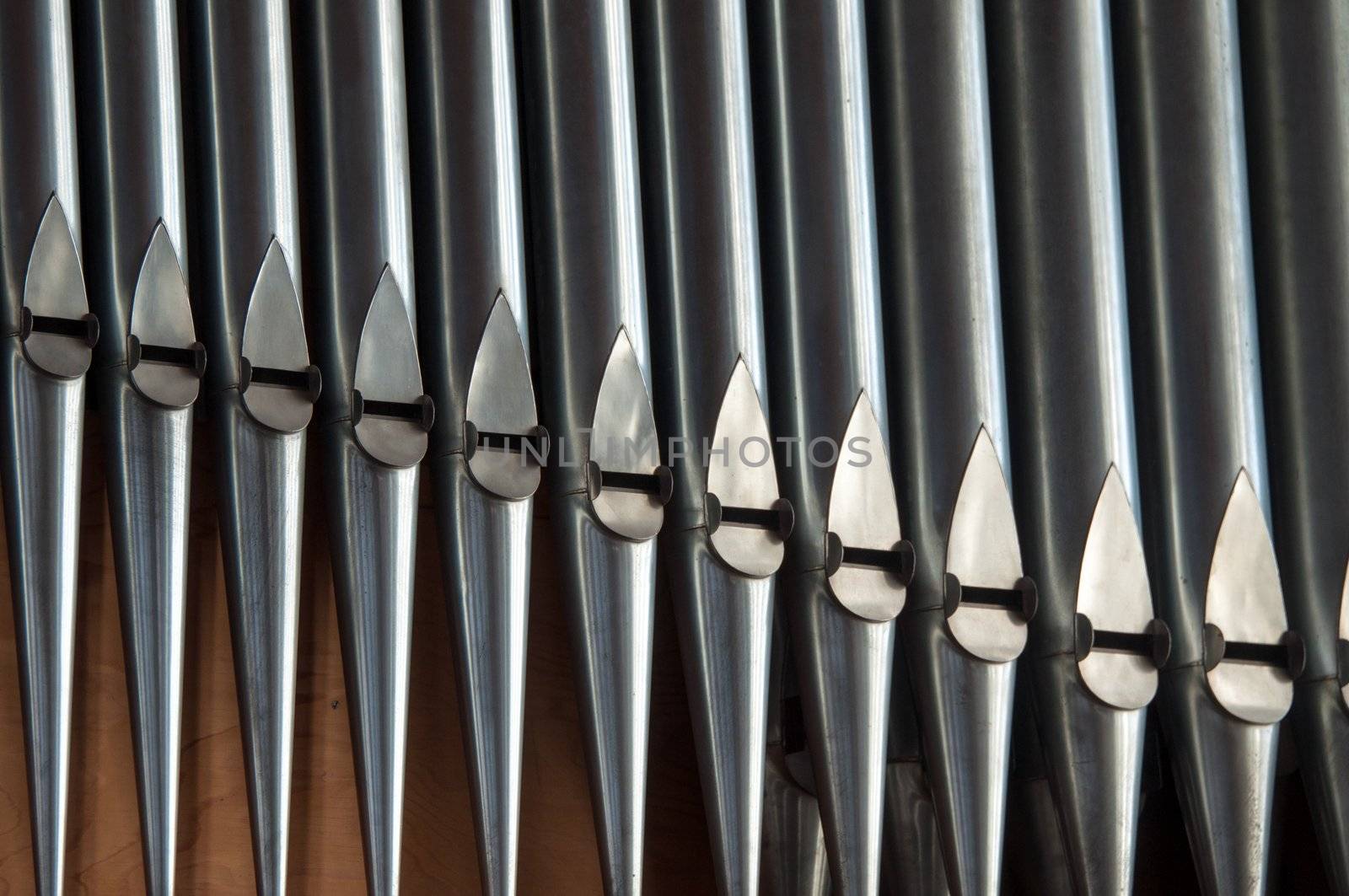 close, almost abstract shot of organ pipes in a church