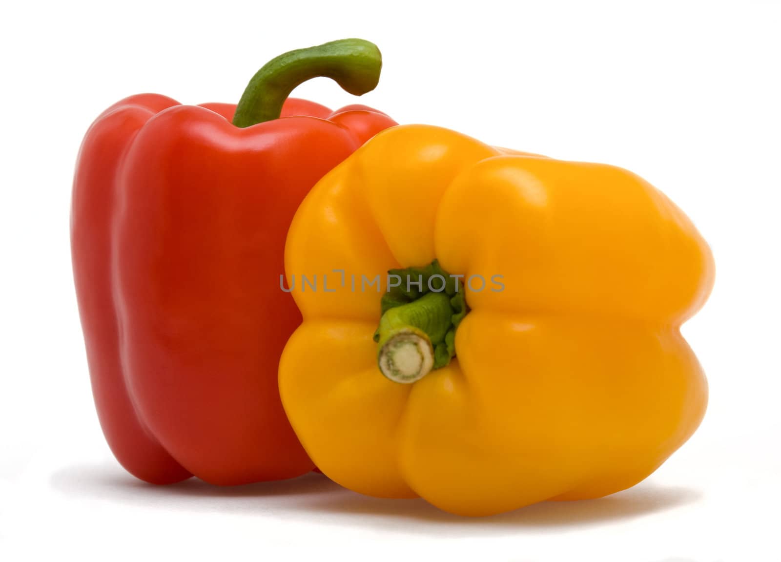 sweet red and yellow peppers isolated on white