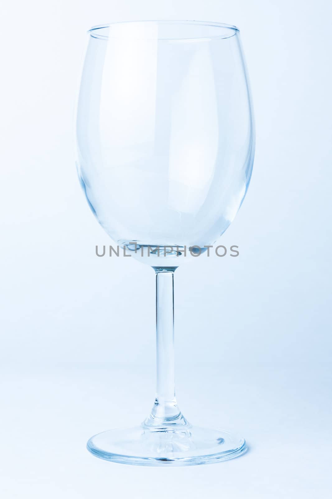 single empty wine glass on white background not isolated