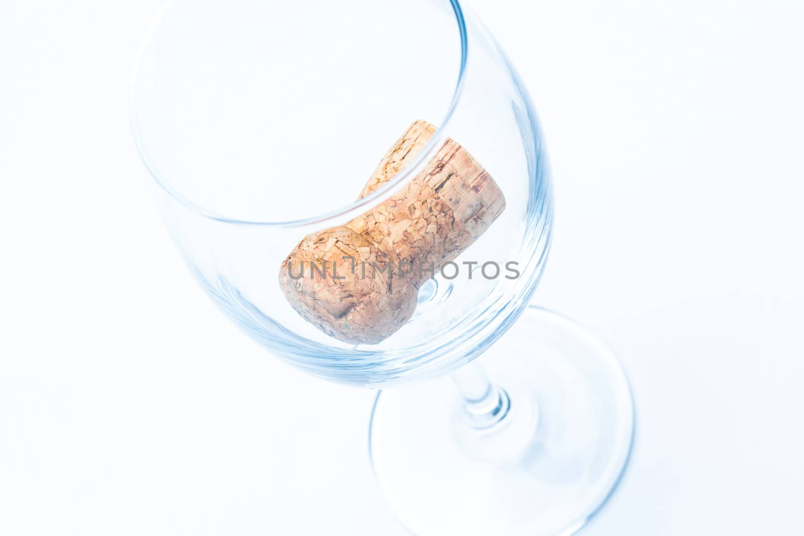 glass of wine with a cork from a bottle