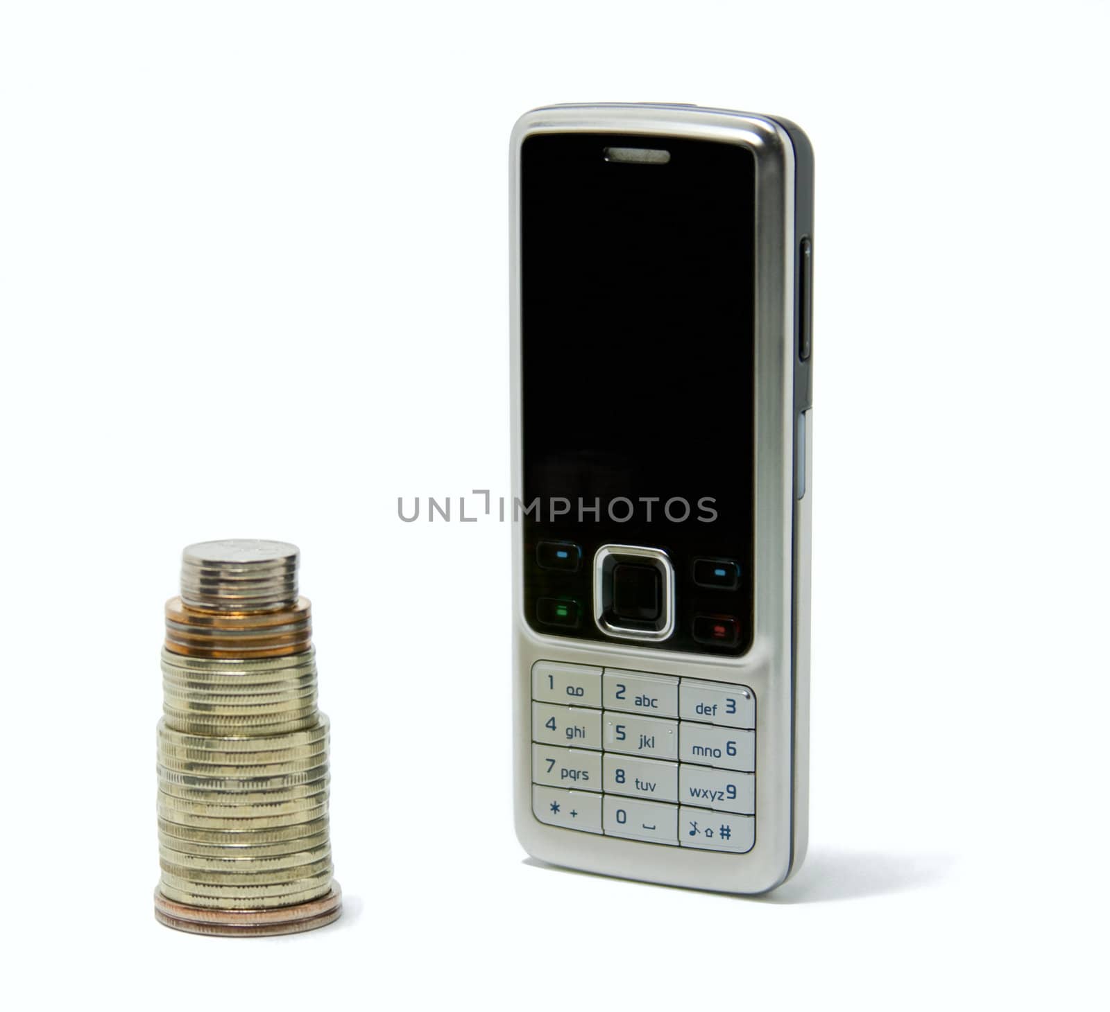 cell phone and a column of coins. isolated on white