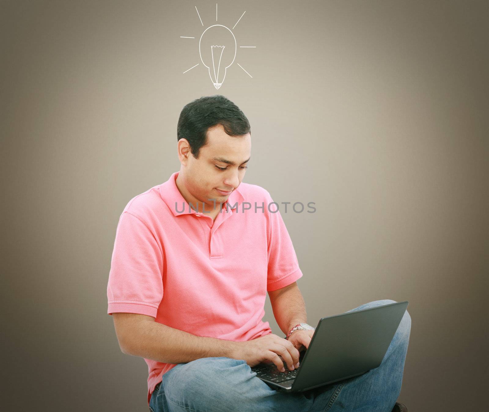 Man using a laptop with light bulb over his head by dacasdo