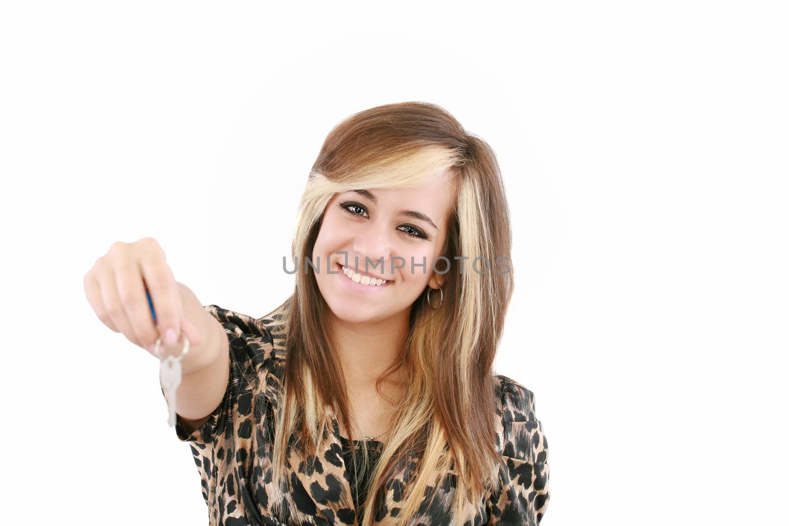 Smiling woman gives over house key. Isolated on white background.