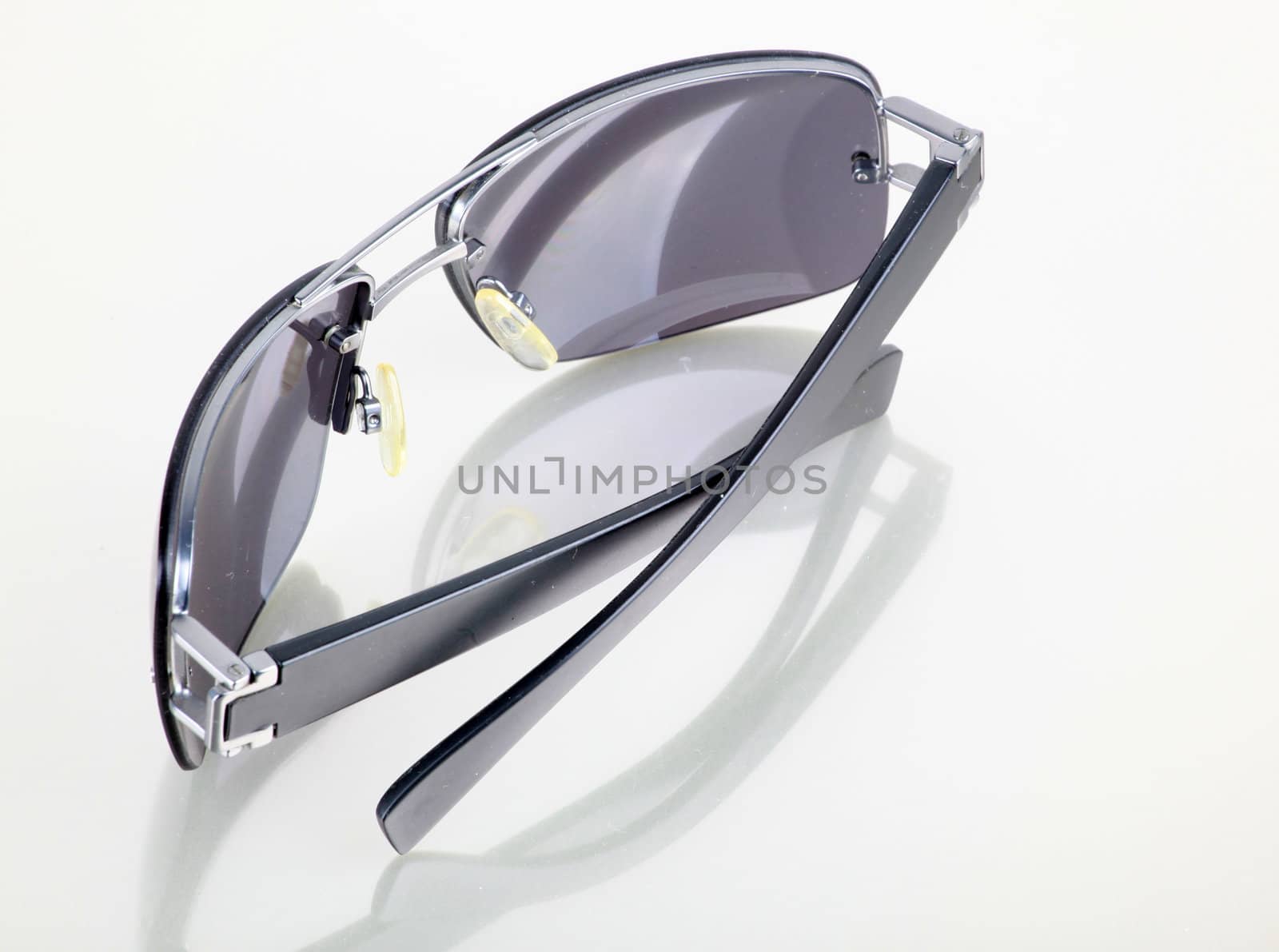 Cut out of Female Sunglasses on white background