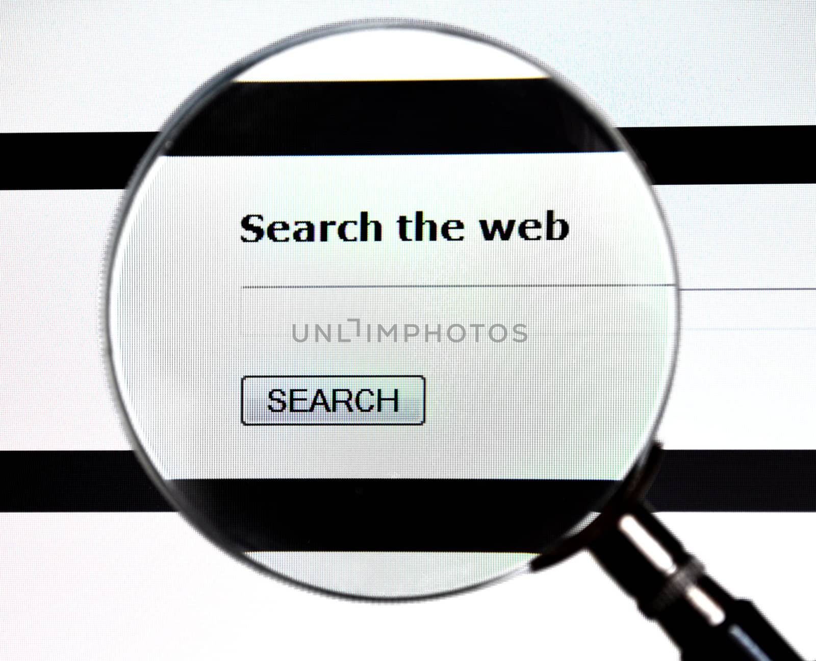 Magnifying glass over web search form on website.