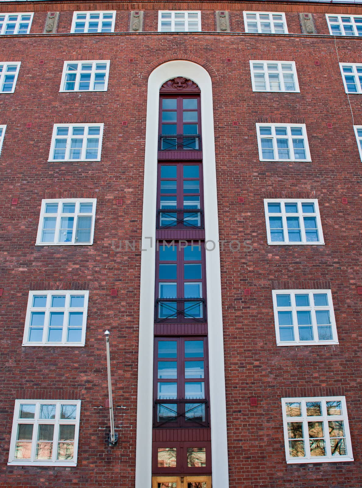 Big red wall with sky blue windows