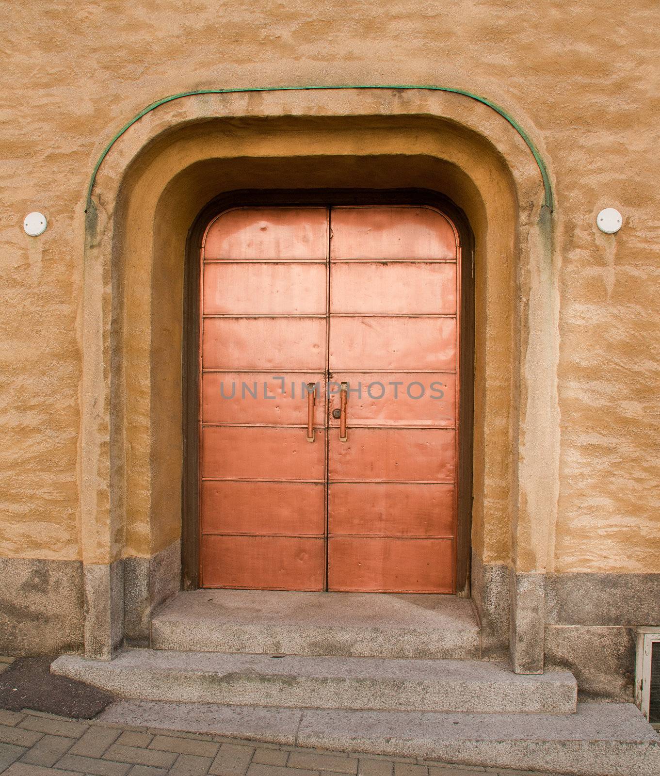 Shiny copper door on a building