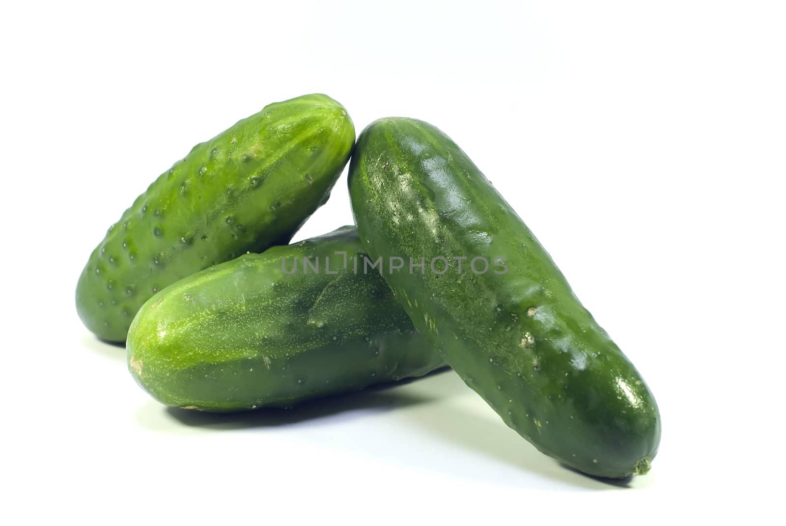 three cucumber on white background