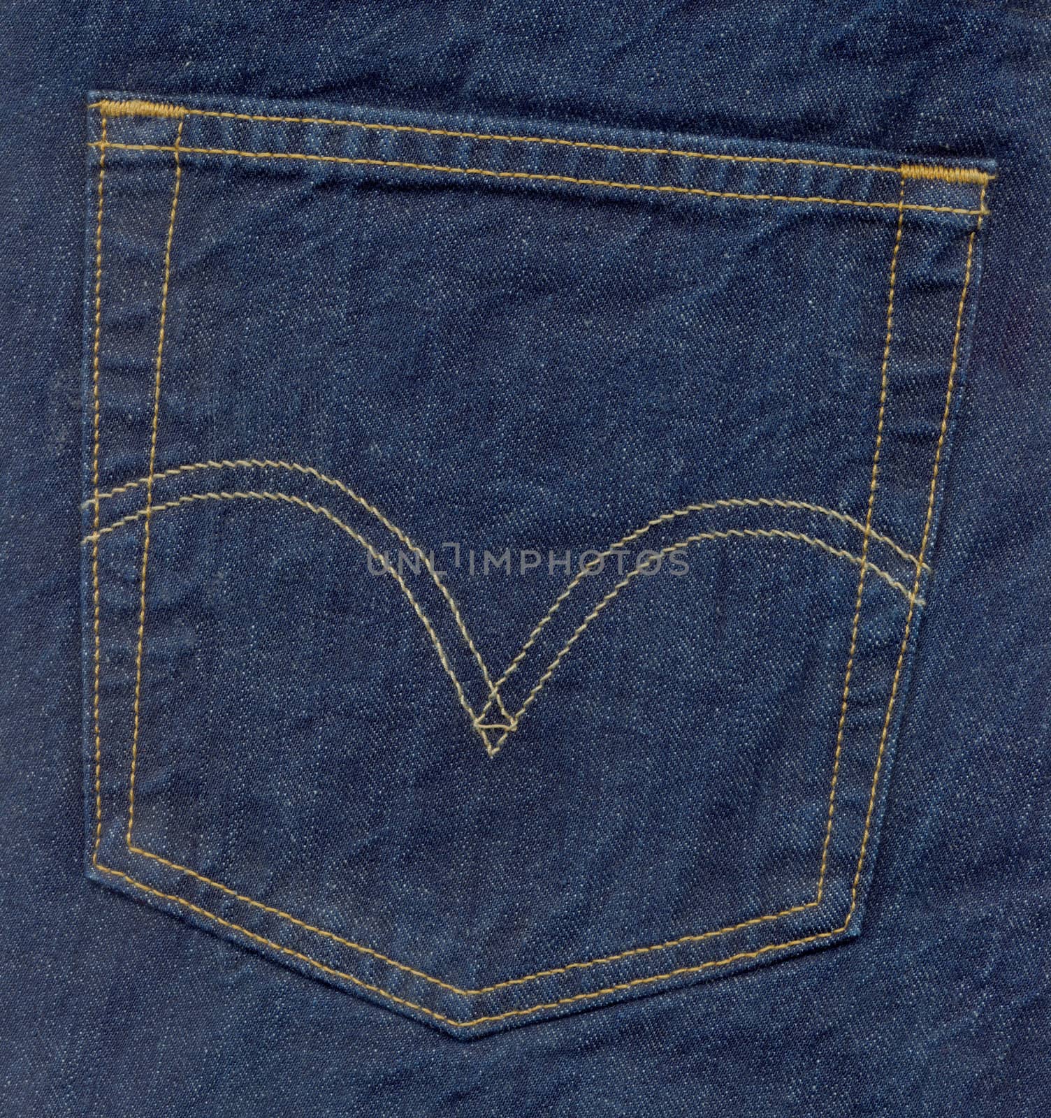 Close up of denim blue jeans back pocket
