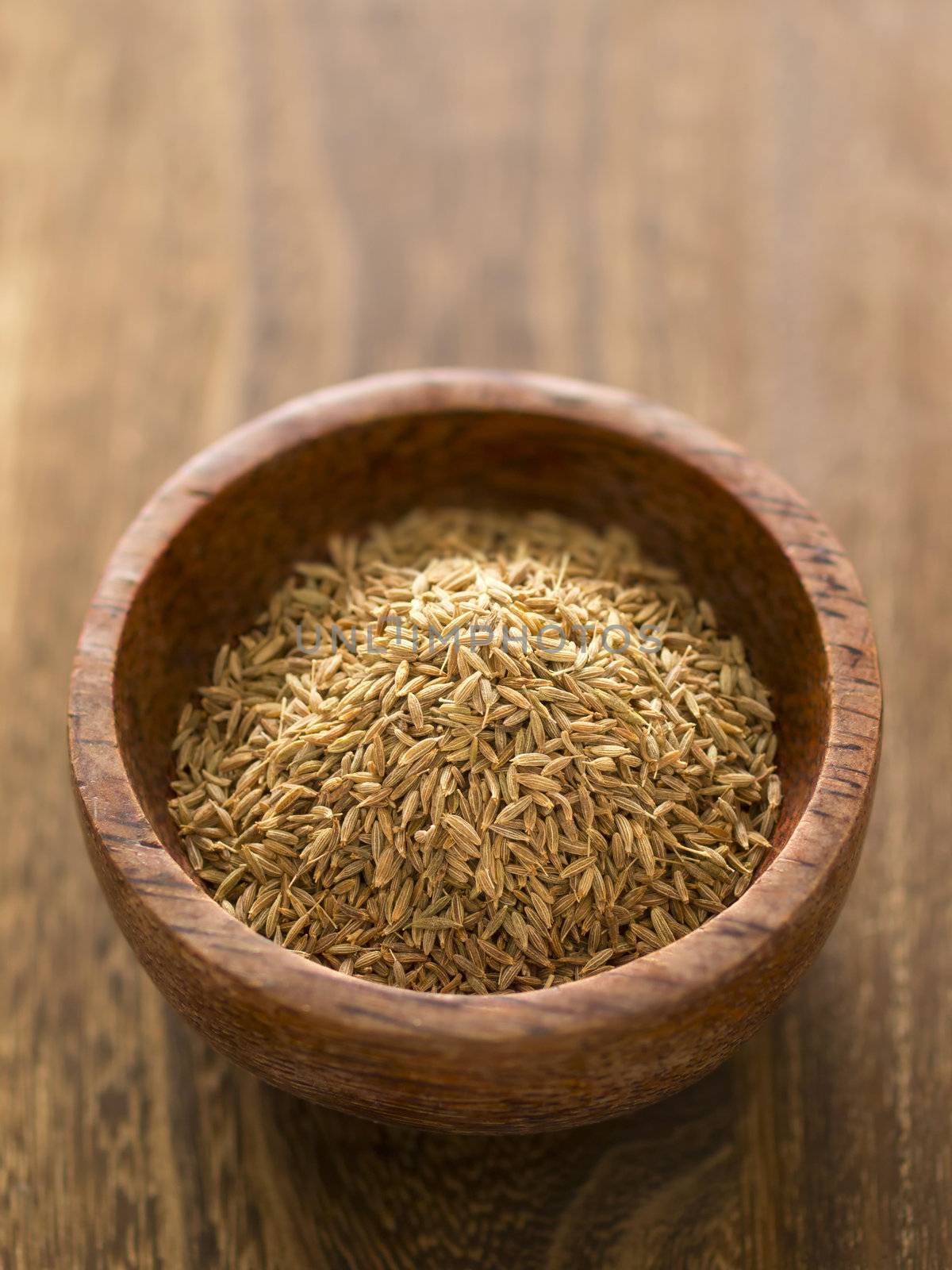 close up of a bowl of cumin seeds