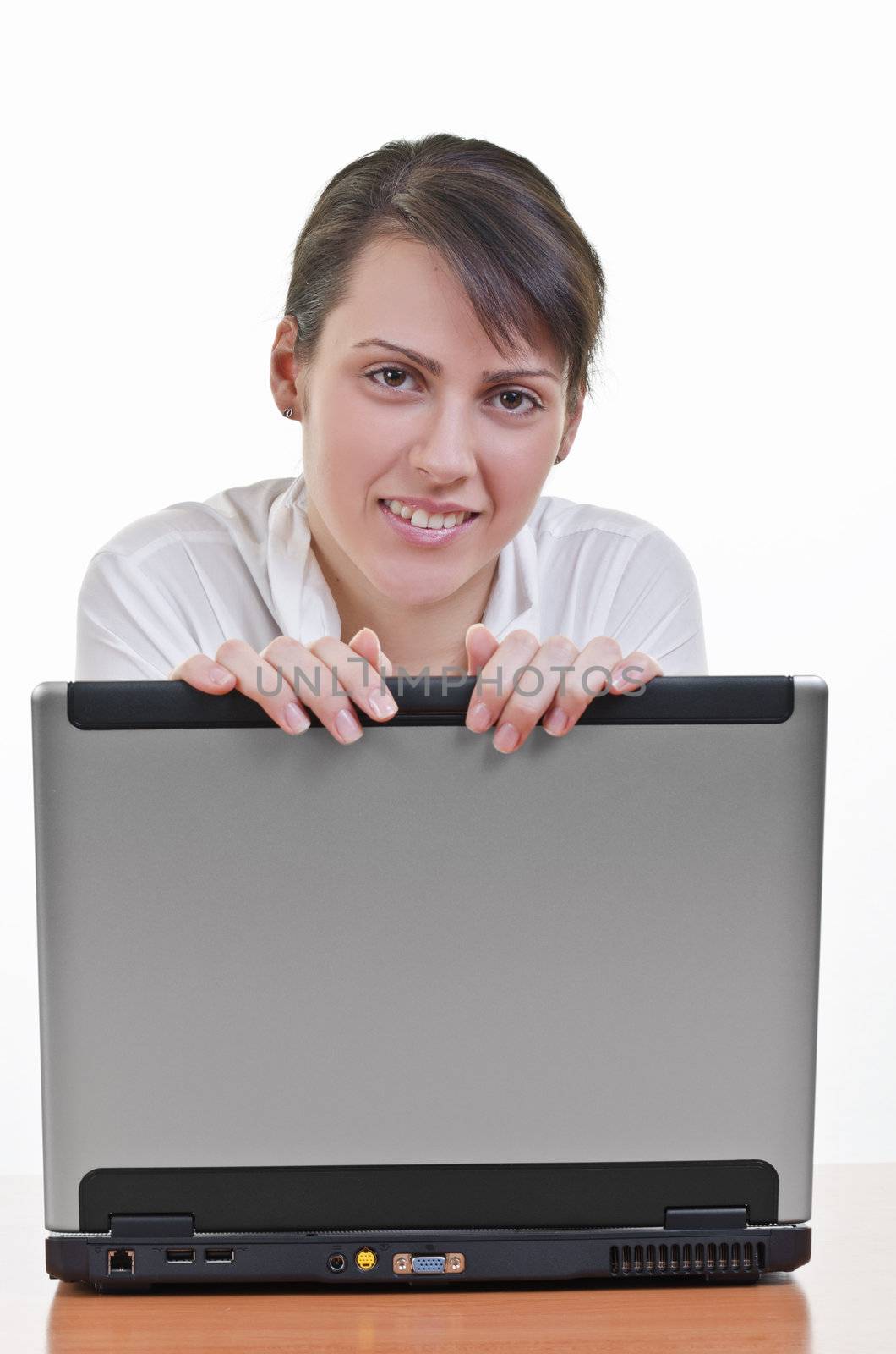 Portrait of happy mature business woman with a laptop computer, high key, eye contact