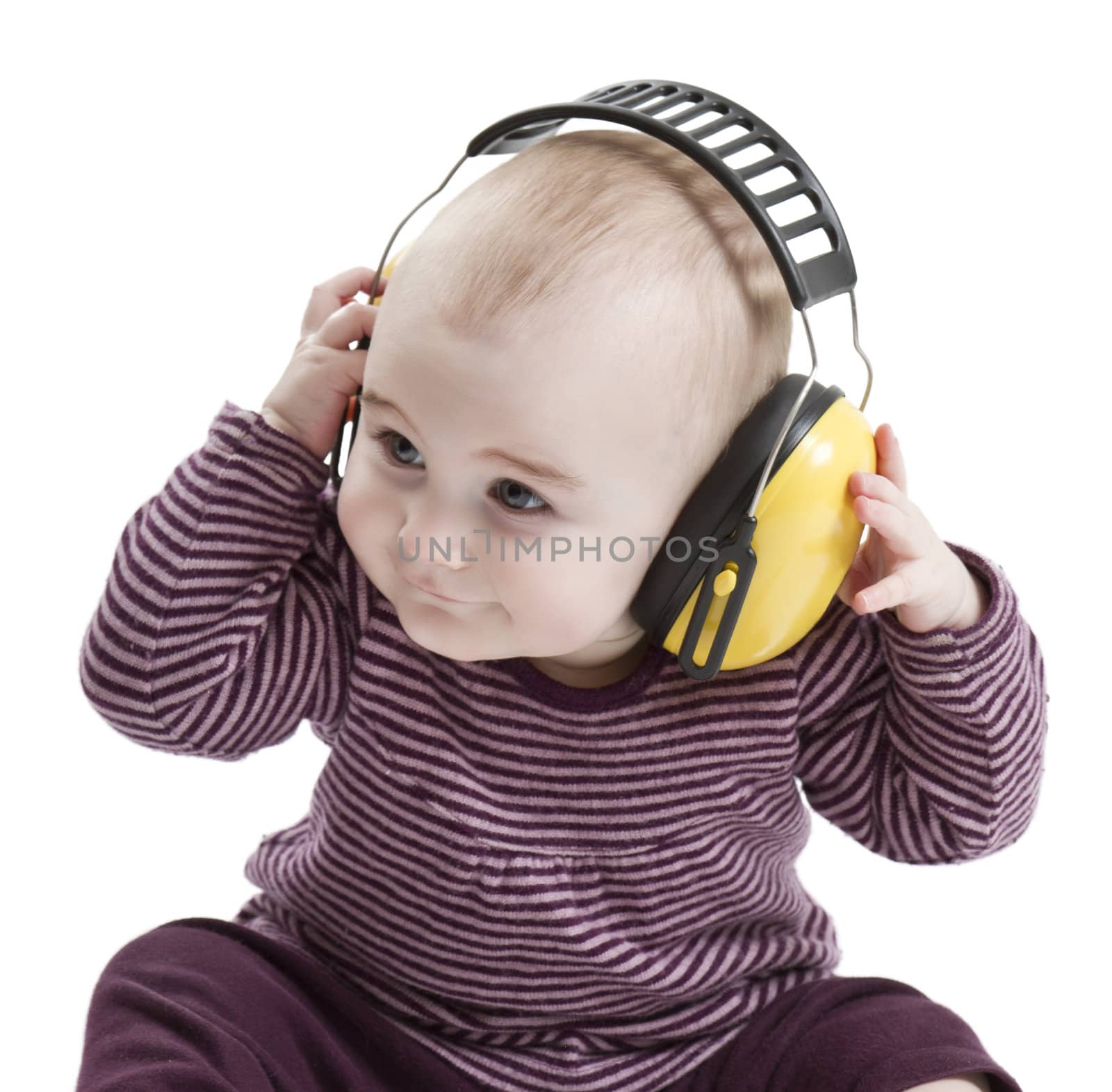 baby with yellow ear protection in loud environment. white background