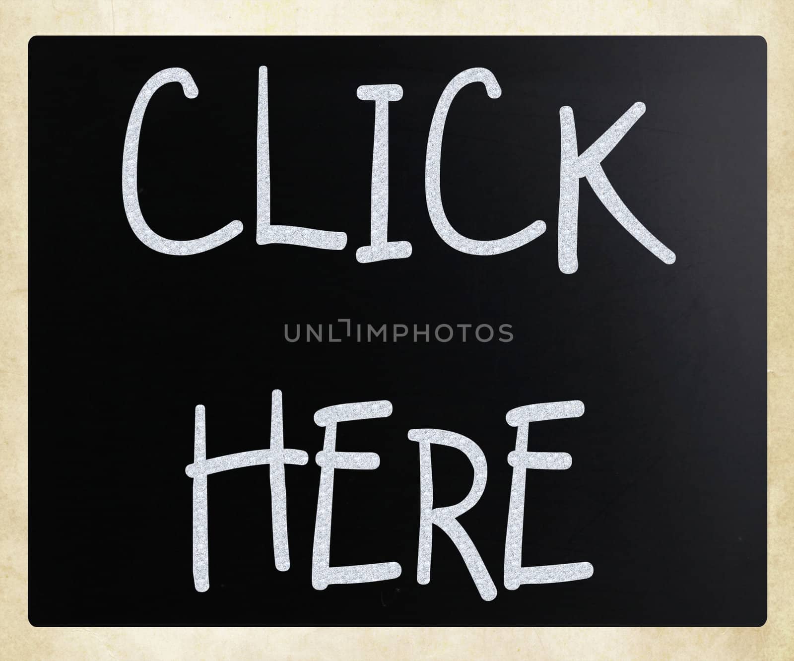 "Click here" handwritten with white chalk on a blackboard by nenov