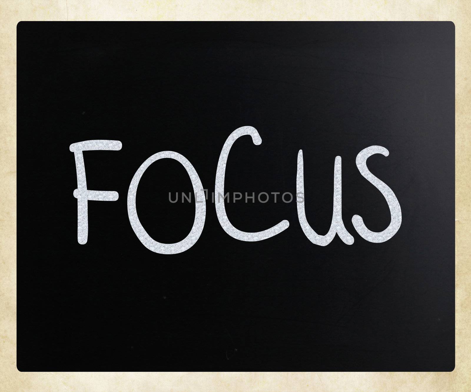 The word "Focus" handwritten with white chalk on a blackboard
