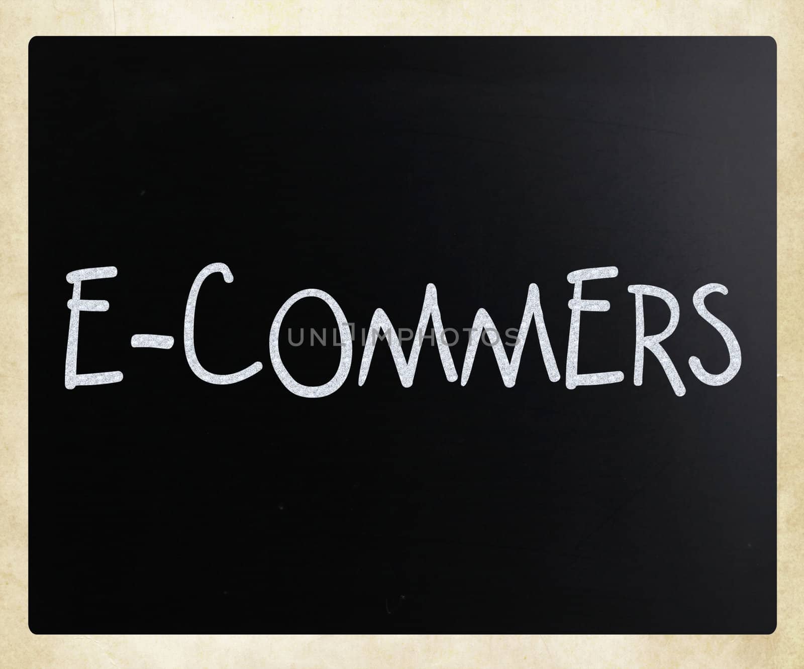 The word "E-commers" handwritten with white chalk on a blackboar by nenov