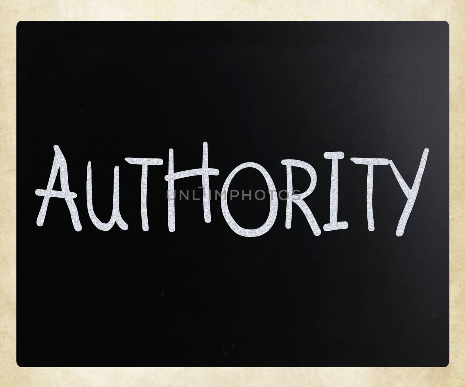 "Authority" handwritten with white chalk on a blackboard
