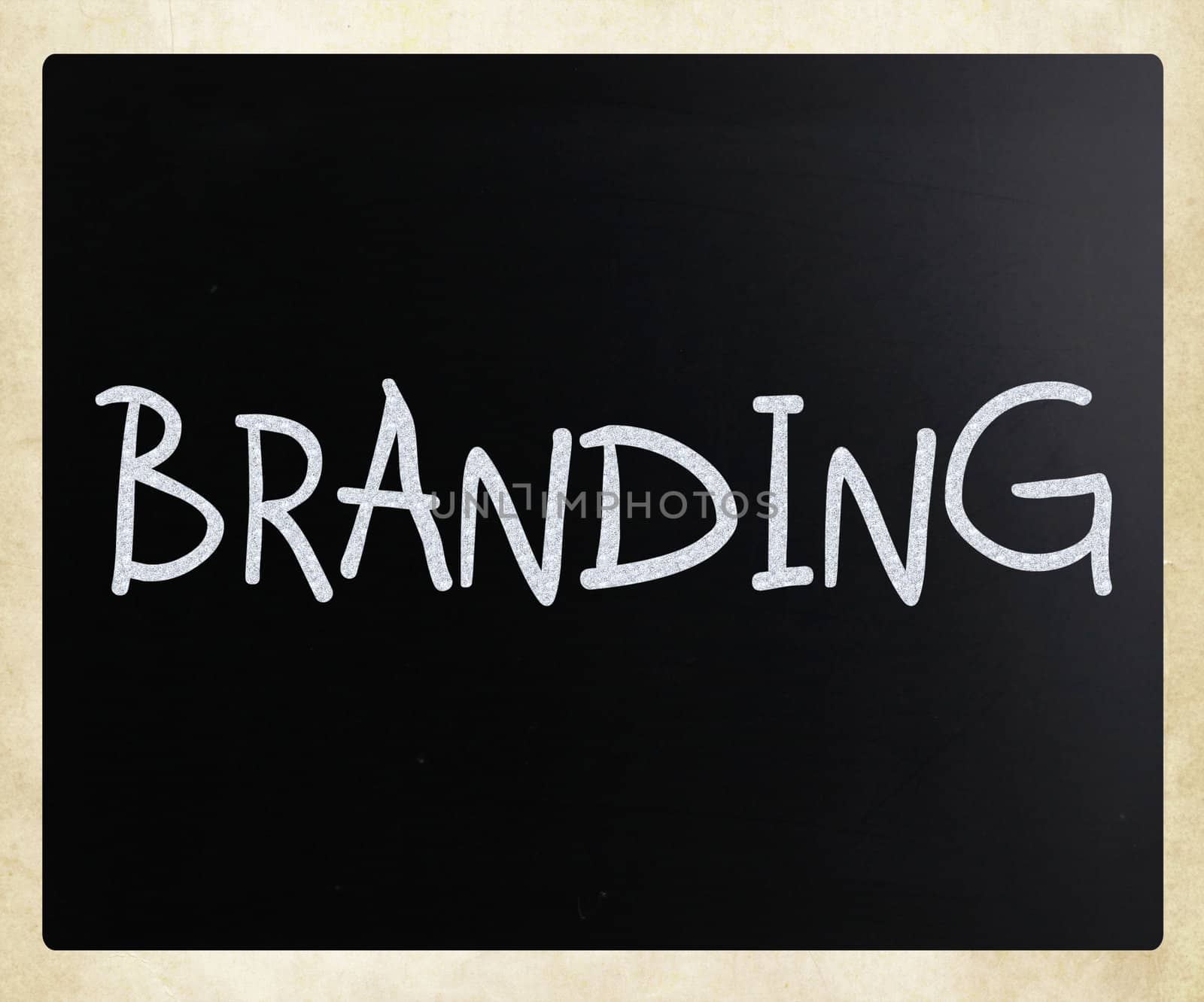 "Branding" handwritten with white chalk on a blackboard